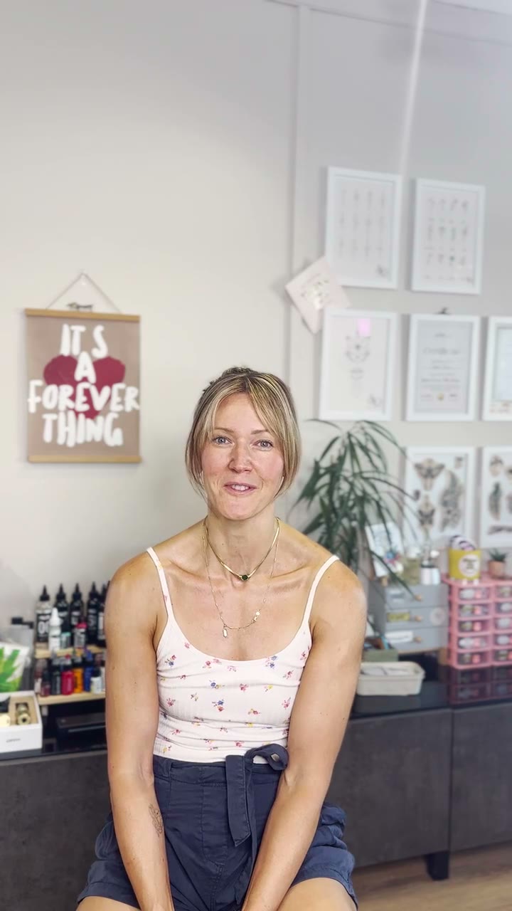 Sophie Dean sitting in the Petite Ink studio, about to tell her story